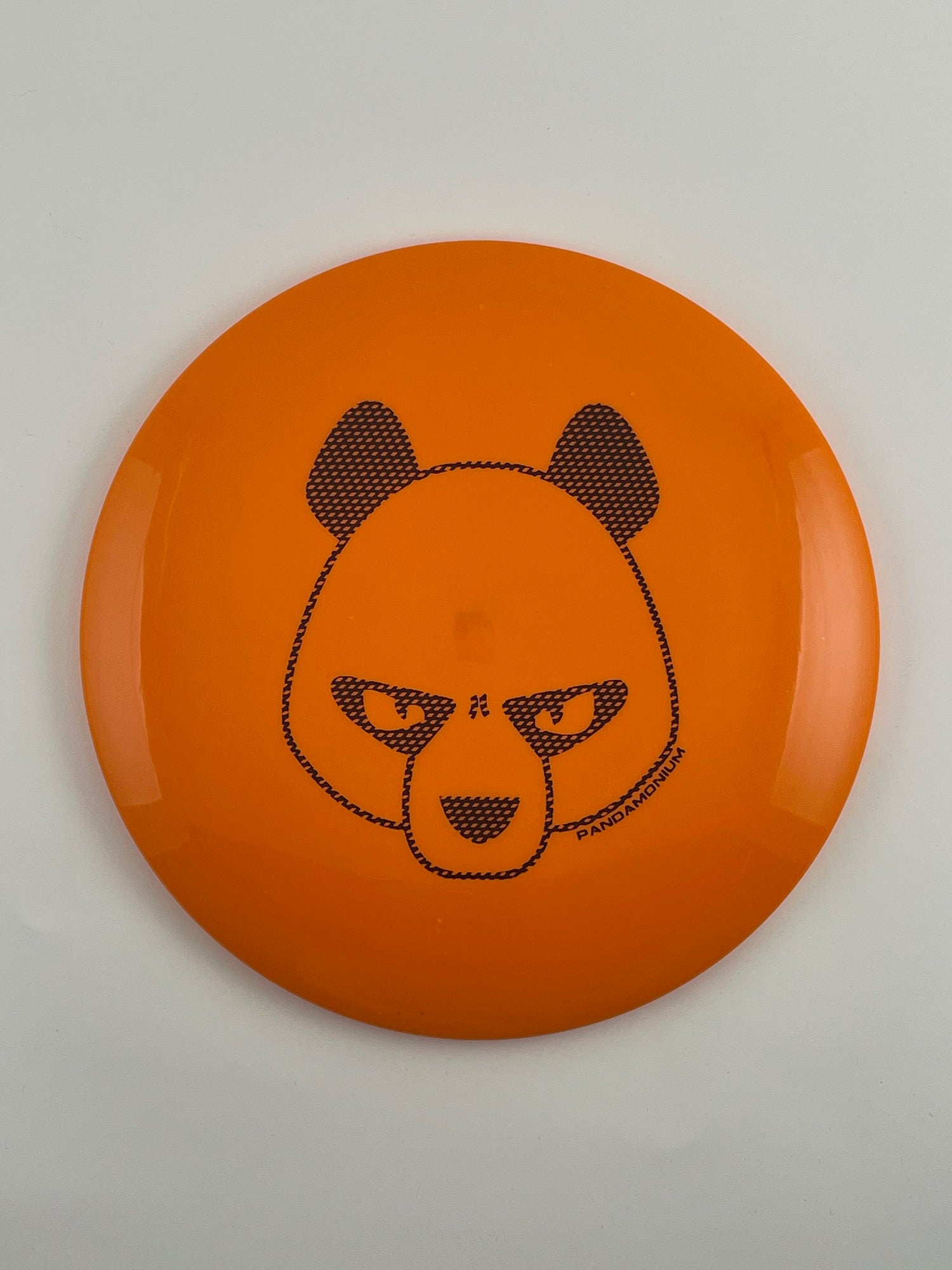 Innova Leopard disc golf fairway driver in orange Star plastic with Pandamonium Big Panda stamp