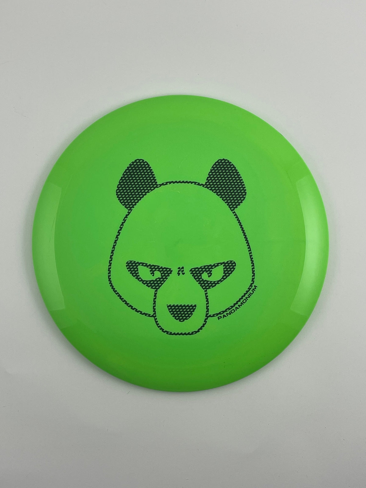 Innova Mamba disc golf distance driver in green Star plastic with Pandamonium Big Panda stamp, view 1