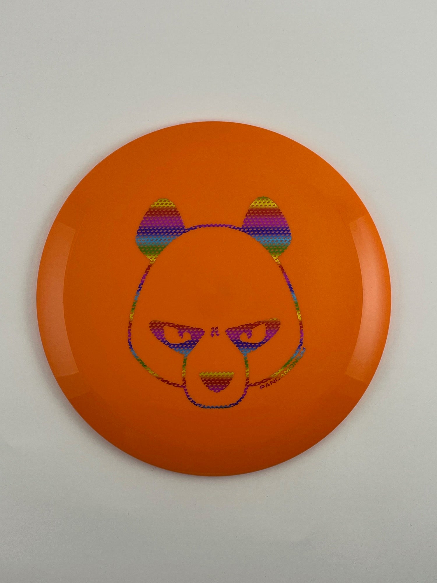 Innova Mamba disc golf distance driver in orange Star plastic with Pandamonium Big Panda stamp, view 2