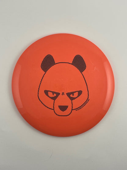 Innova Valkyrie disc golf fairway driver in coral Star plastic with Pandamonium Big Panda stamp
